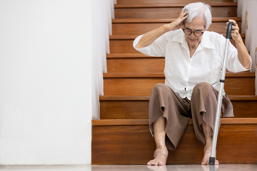 Elderly Woman at Bottom of Stairs
