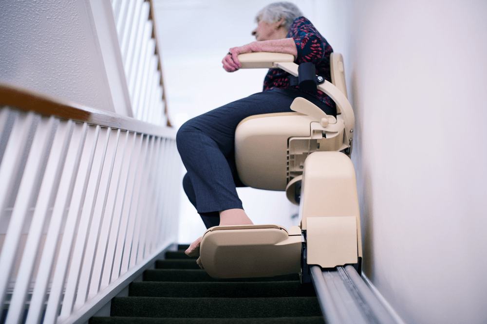 Woman Going up a Stairlift